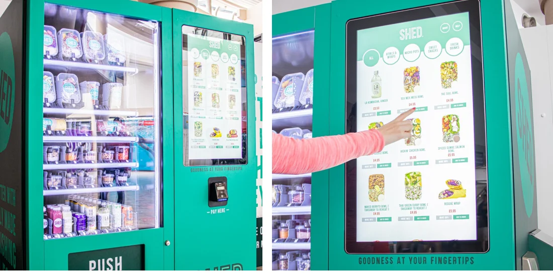 Person using Shed Branded vending machine