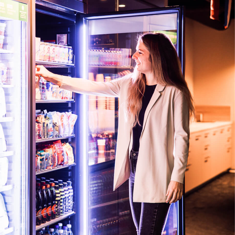 Customer choosing a product from a Boost machine