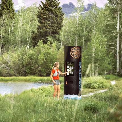 Runner using machine in the forest