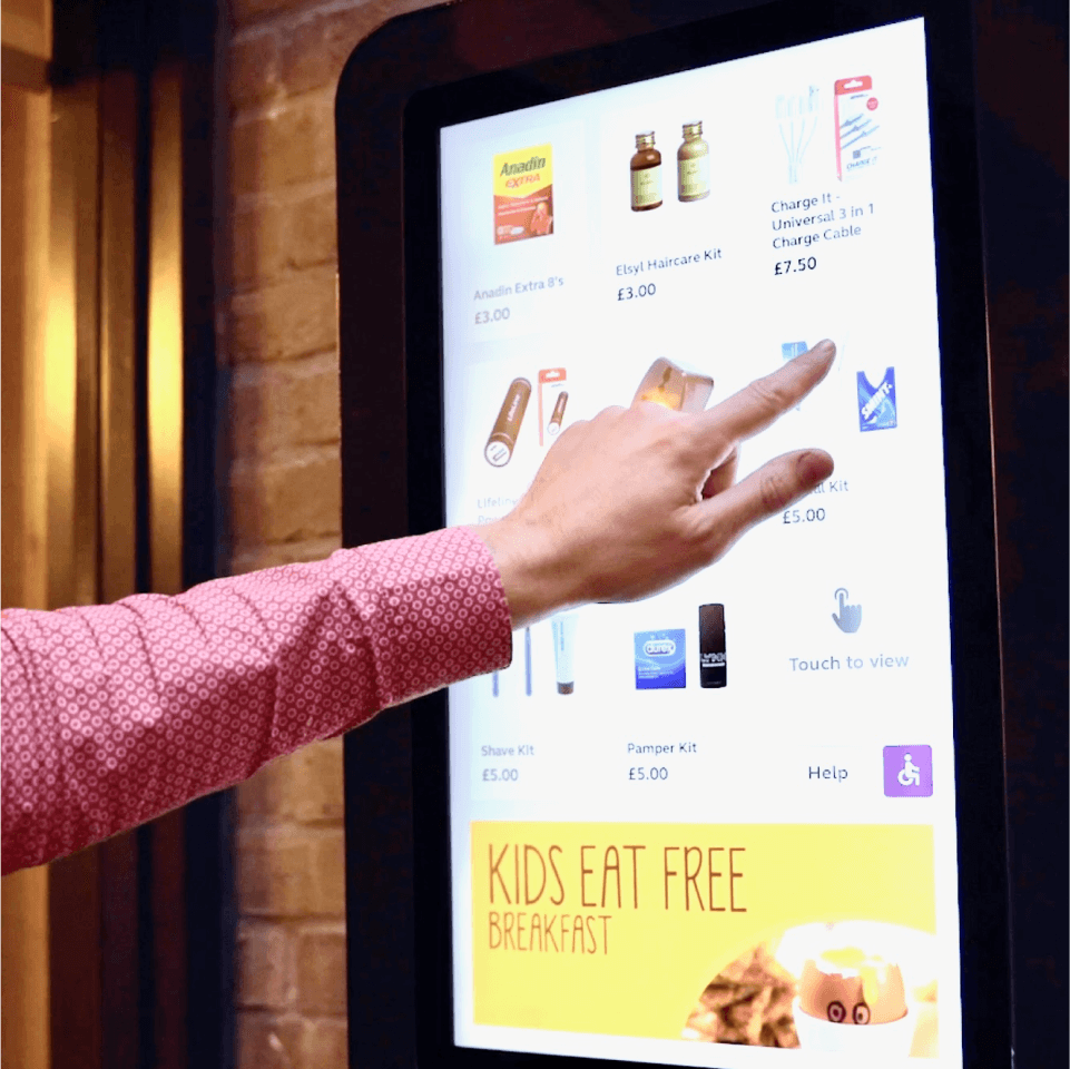 Woman using screen to select her purchase